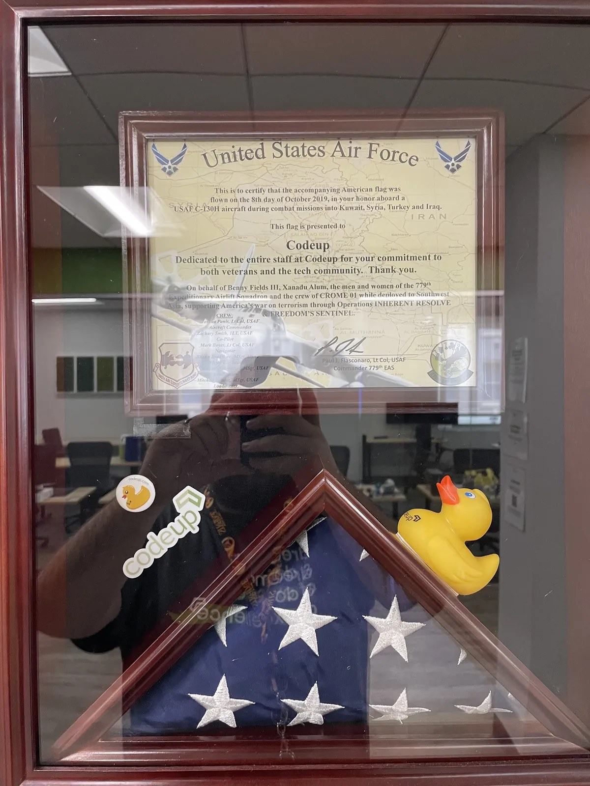 Framed flag presented to Codeup for its commitment to veterans