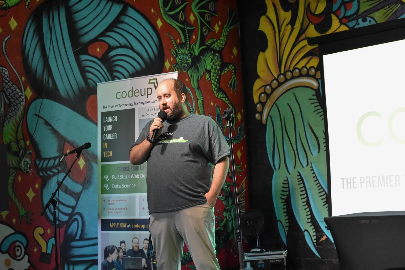 Ben Campbell speaking on stage at a Codeup event